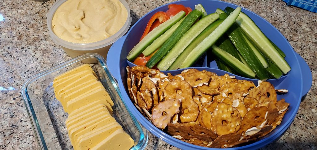Plant-based Cheddar Cheese, Veggies, Hummus and Pretzel Crisps!