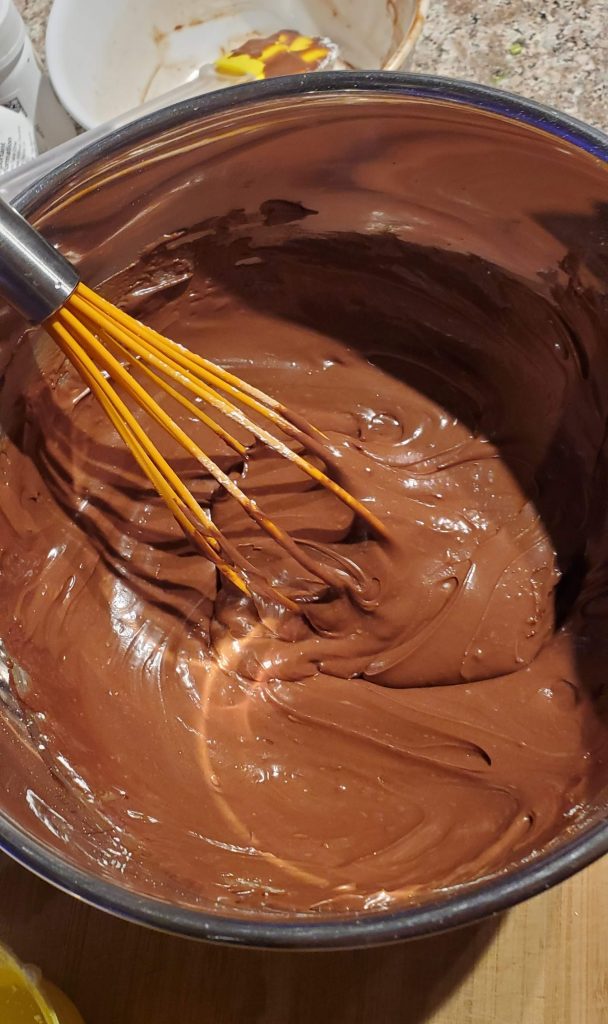 Mixing up some chocolate frosting!